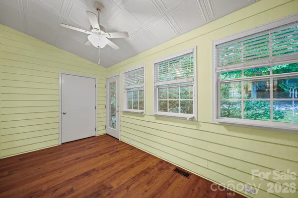 a view of an entryway with wooden floor