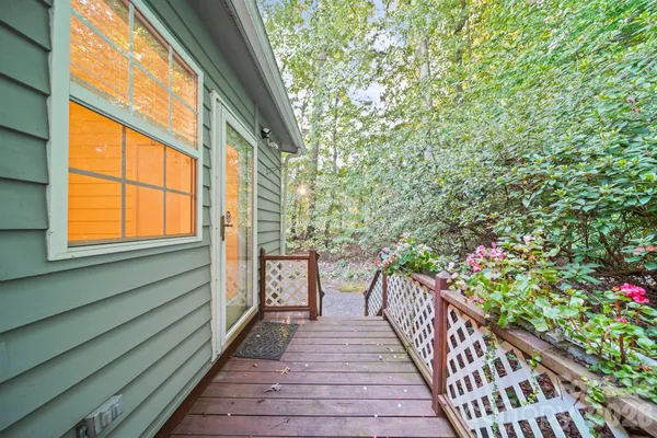 a view of a balcony with wooden floor