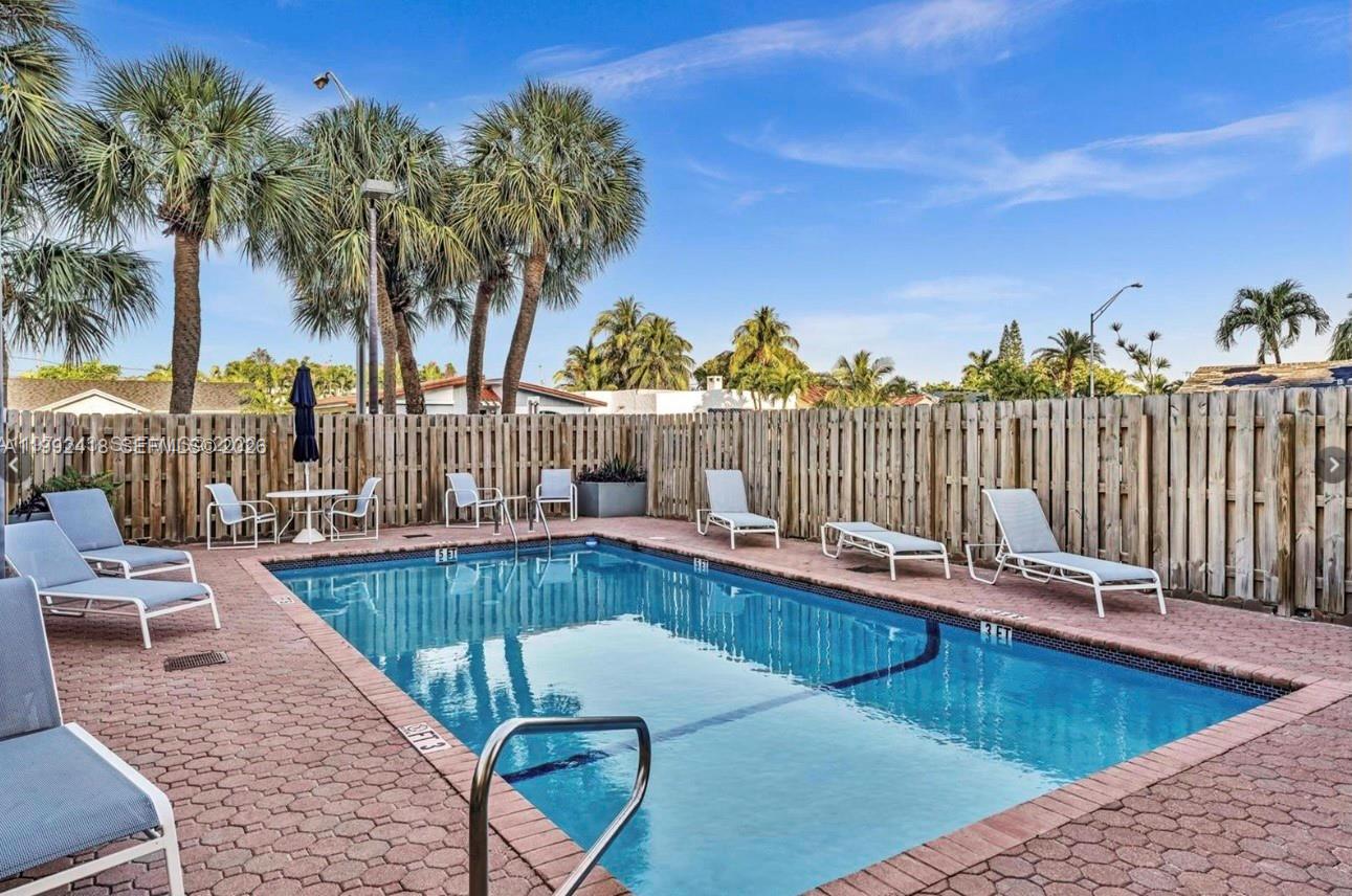 8900 Collins Avenue, Unit 304 Surfside, FL 33154 - Photo 17 of 18 a view of a chairs and table on the terrace