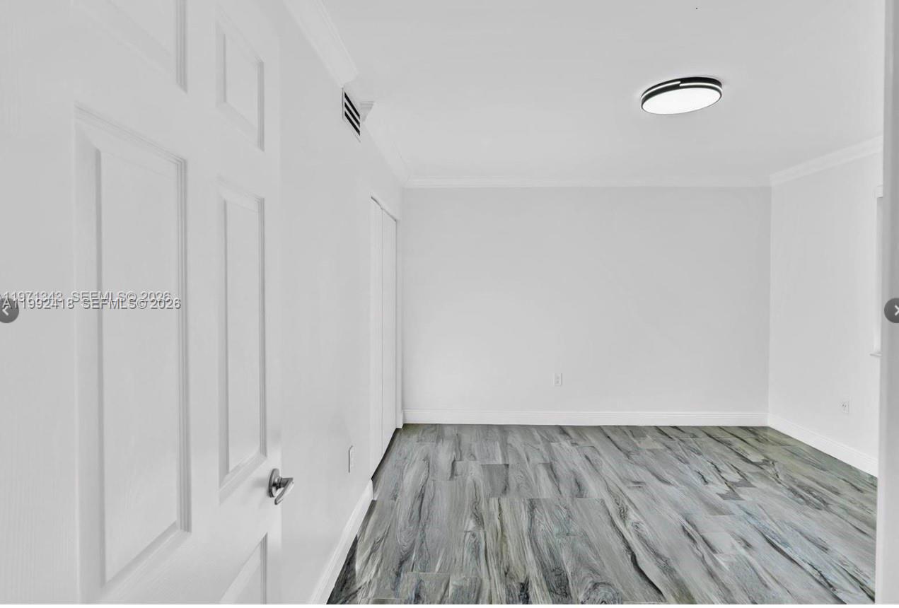 8900 Collins Avenue, Unit 304 Surfside, FL 33154 - Photo 6 of 18 a view of small space with racks on the wall