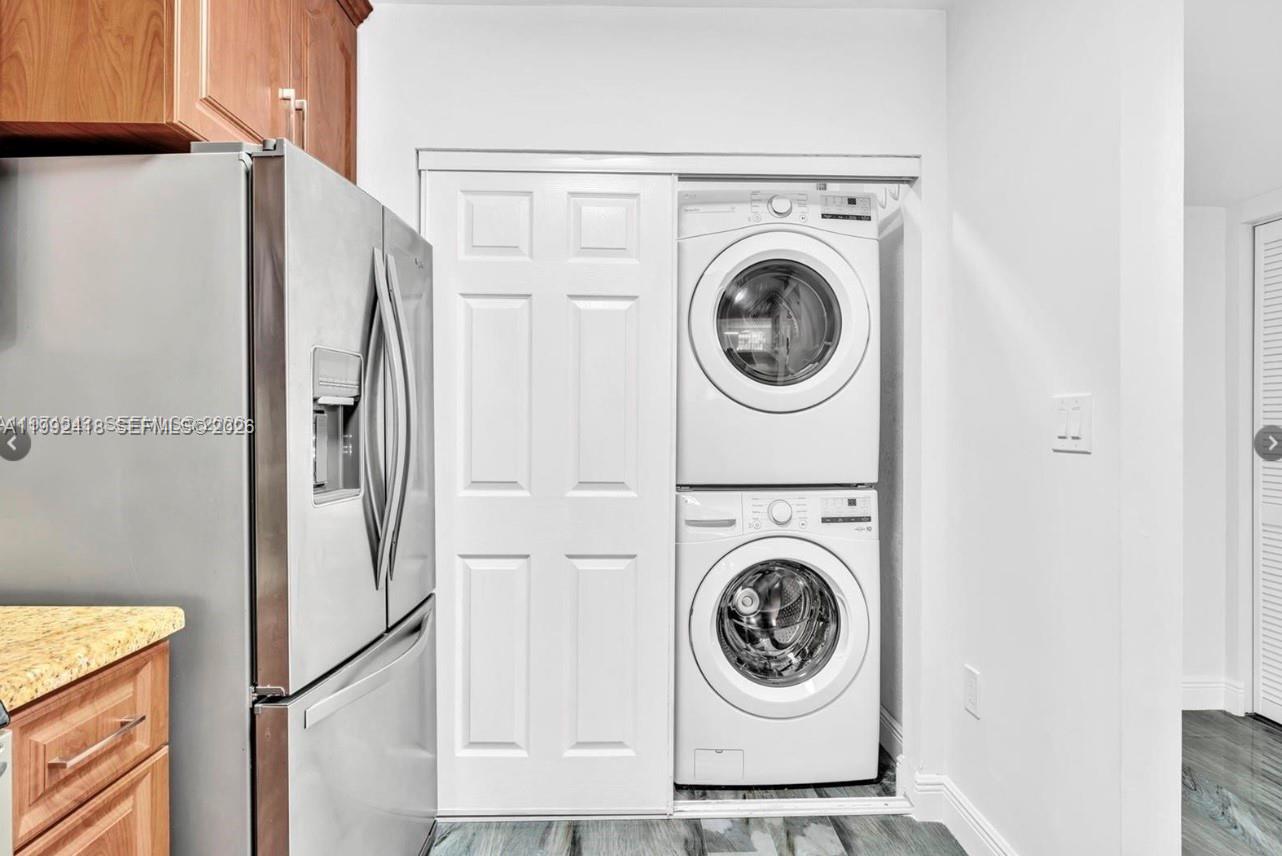 8900 Collins Avenue, Unit 304 Surfside, FL 33154 - Photo 8 of 18 a utility room with dryer and washer