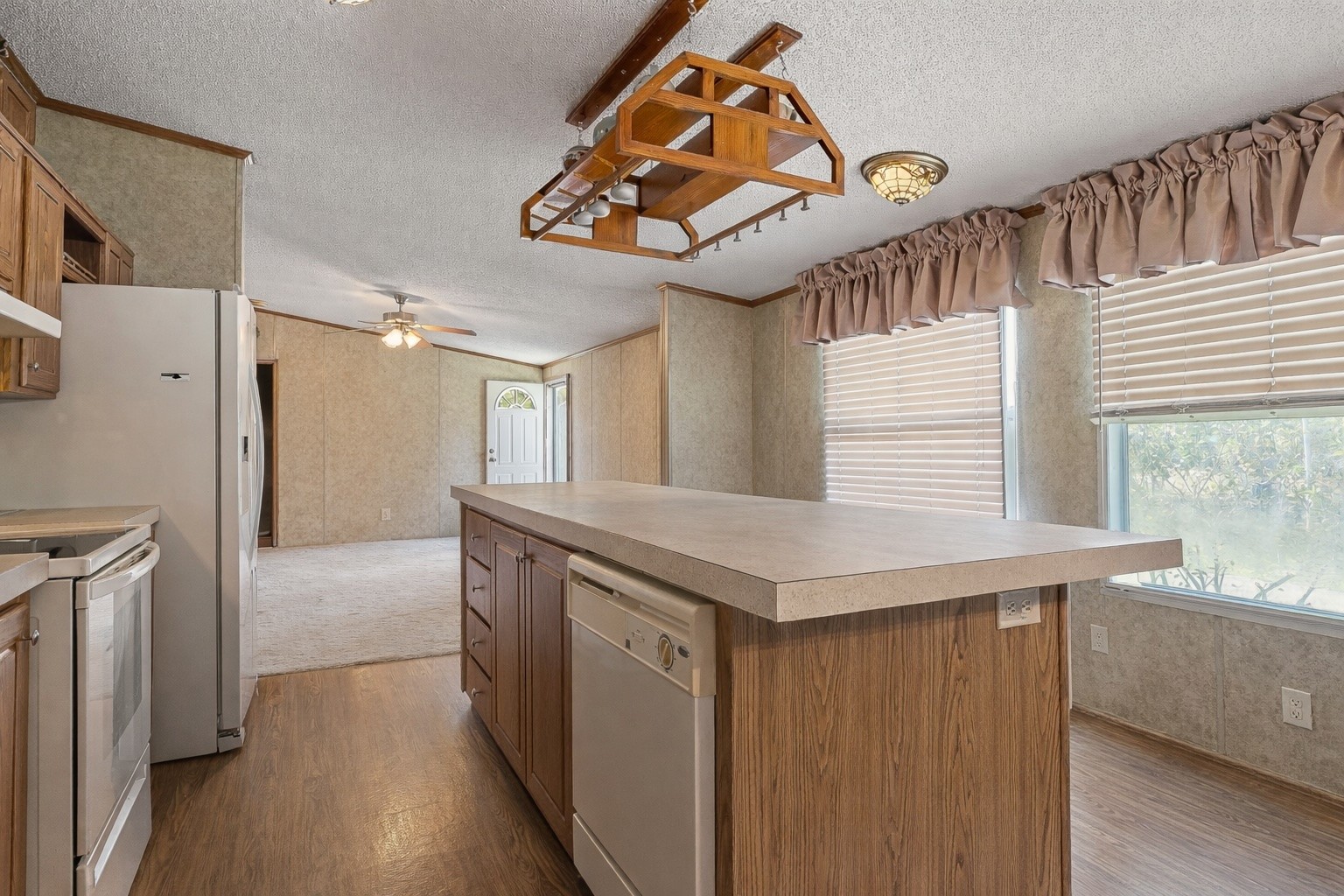 318 Autumn Road Morrison, TN 37357 - Photo 5 of 17 a kitchen with a refrigerator a sink and dishwasher with wooden floor