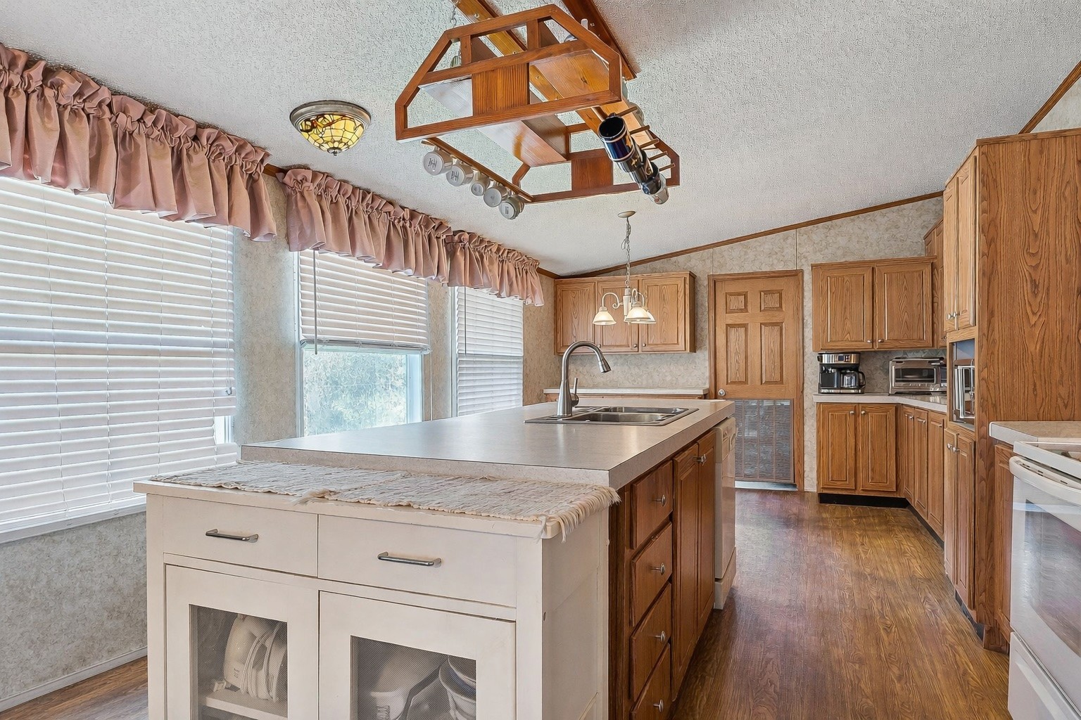 318 Autumn Road Morrison, TN 37357 - Photo 6 of 17 a kitchen with a stove a sink and a refrigerator