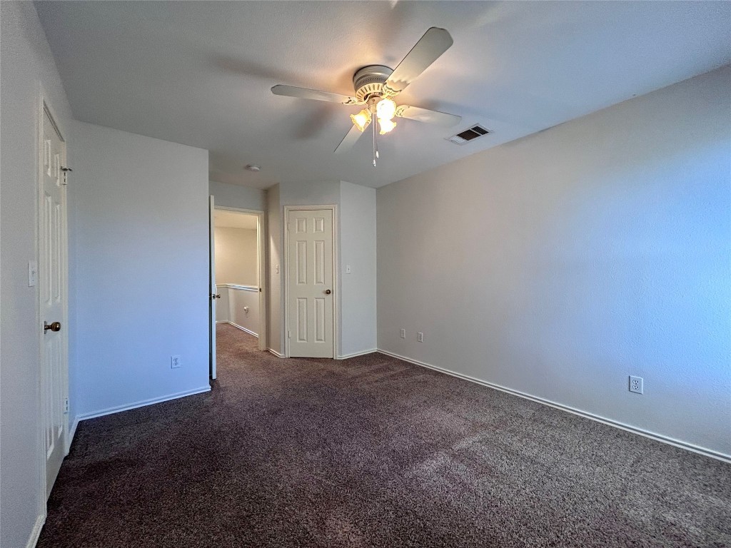 12307 Abney Drive Austin, TX 78729 - Photo 13 of 18 a view of an empty room with a chandelier fan