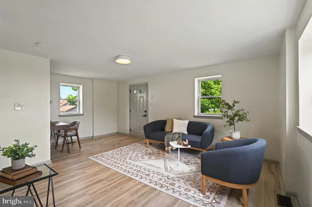 a living room with furniture and a window
