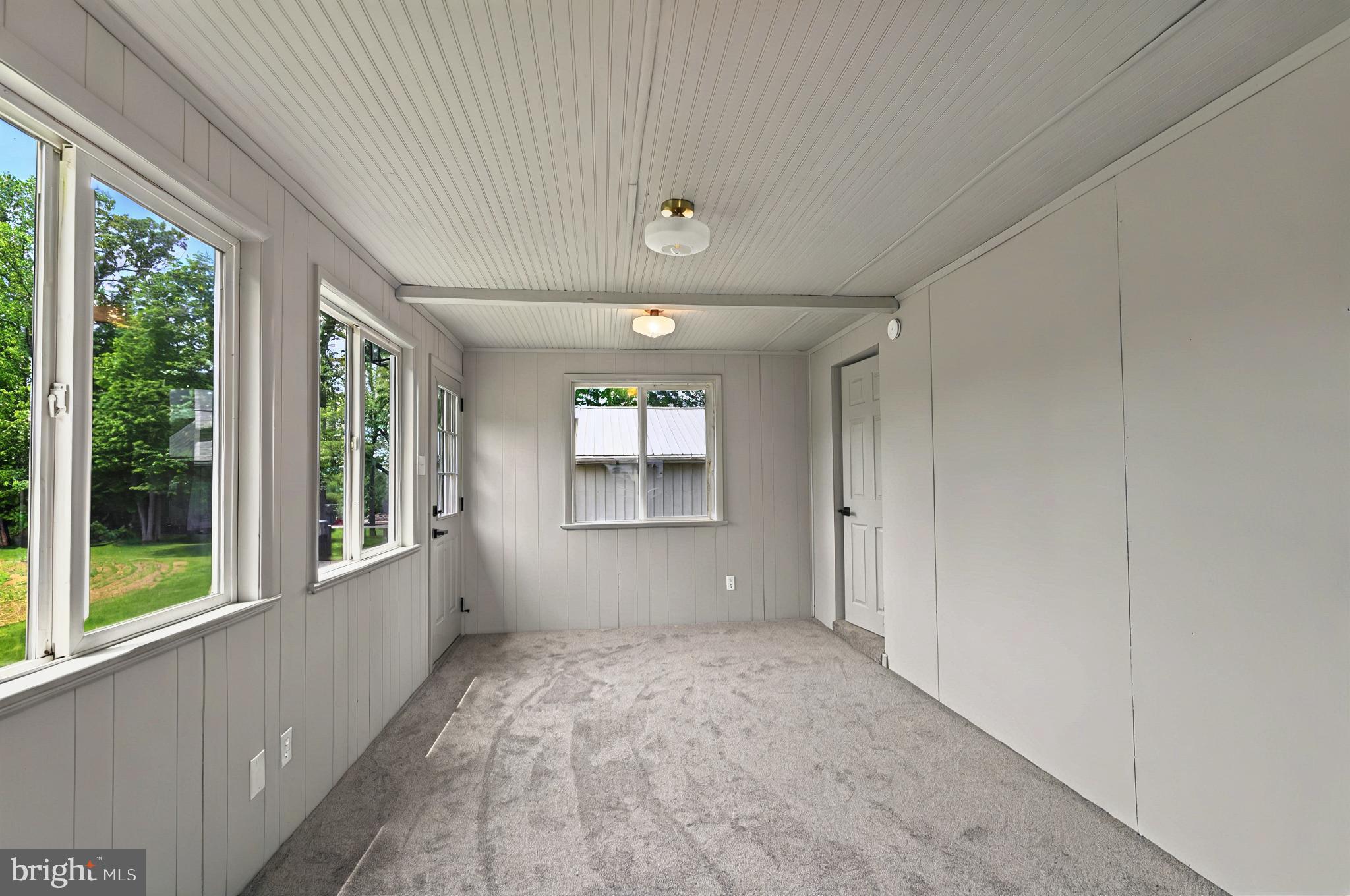 222 Old Racetrack Road Parkesburg, PA 19365 - Photo 20 of 37 a view of empty room with wooden floor and fan