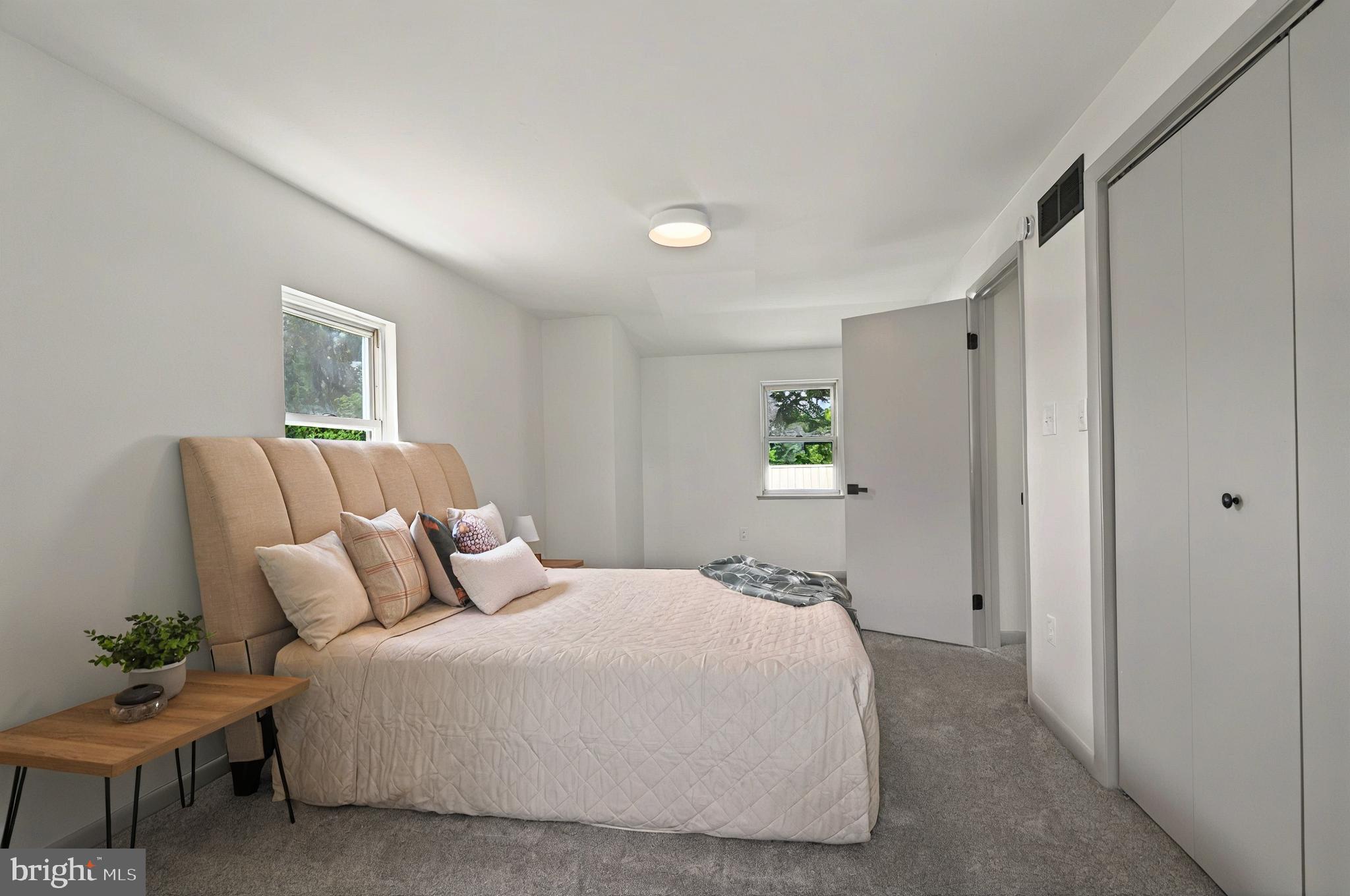 222 Old Racetrack Road Parkesburg, PA 19365 - Photo 22 of 37 a bedroom with a bed and a couch