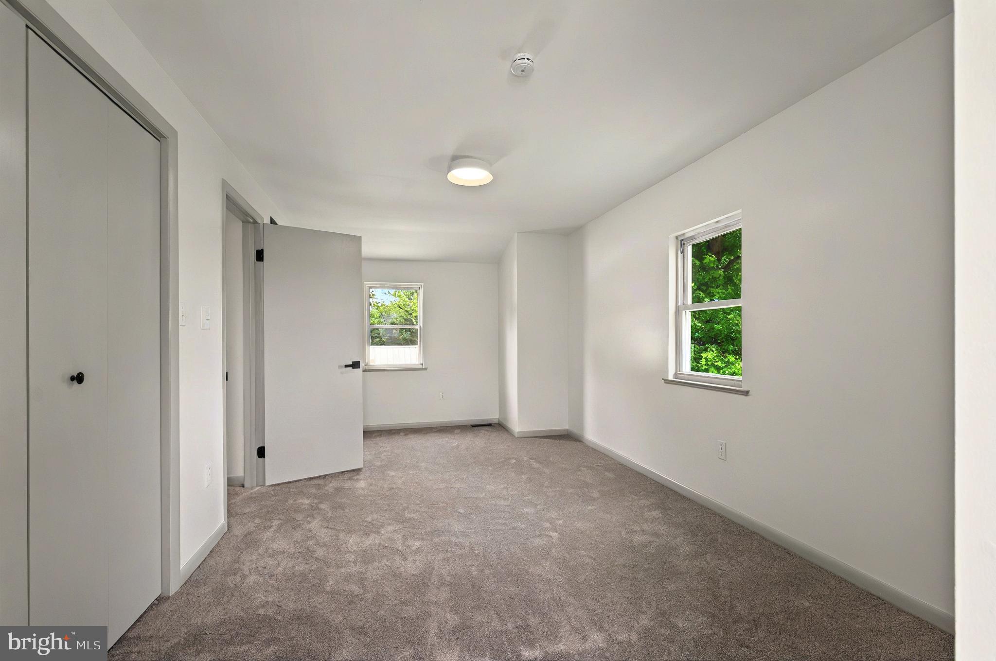 222 Old Racetrack Road Parkesburg, PA 19365 - Photo 26 of 37 an empty room with windows and closet