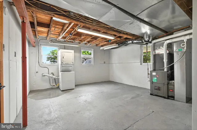a view of empty room with wooden walls