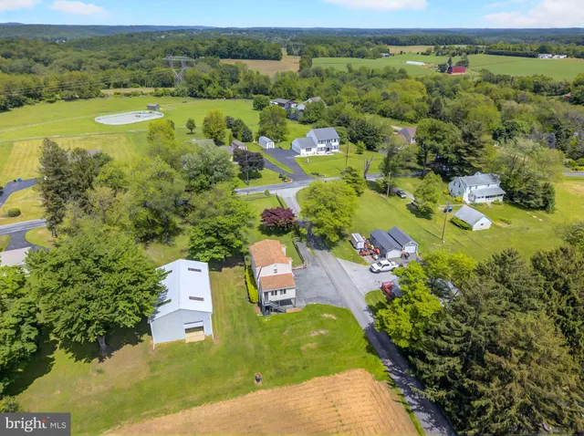 an aerial view of residential house with outdoor space