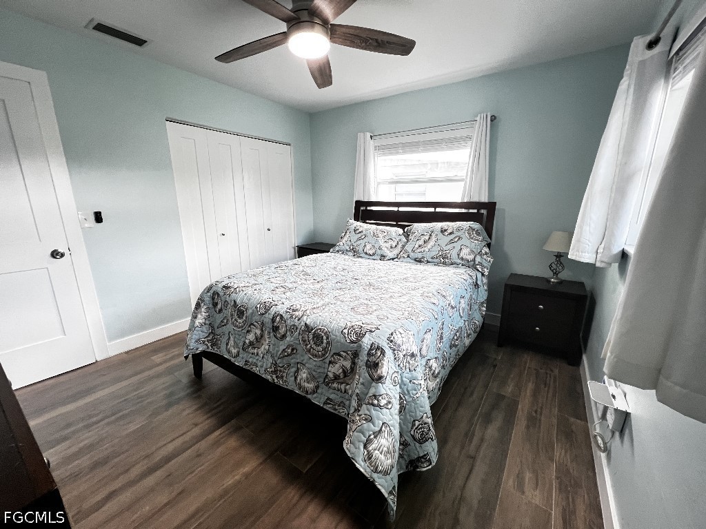 144 Whidden Road North Fort Myers, FL 33917 - Photo 8 of 16 a bedroom with a bed and a mirror