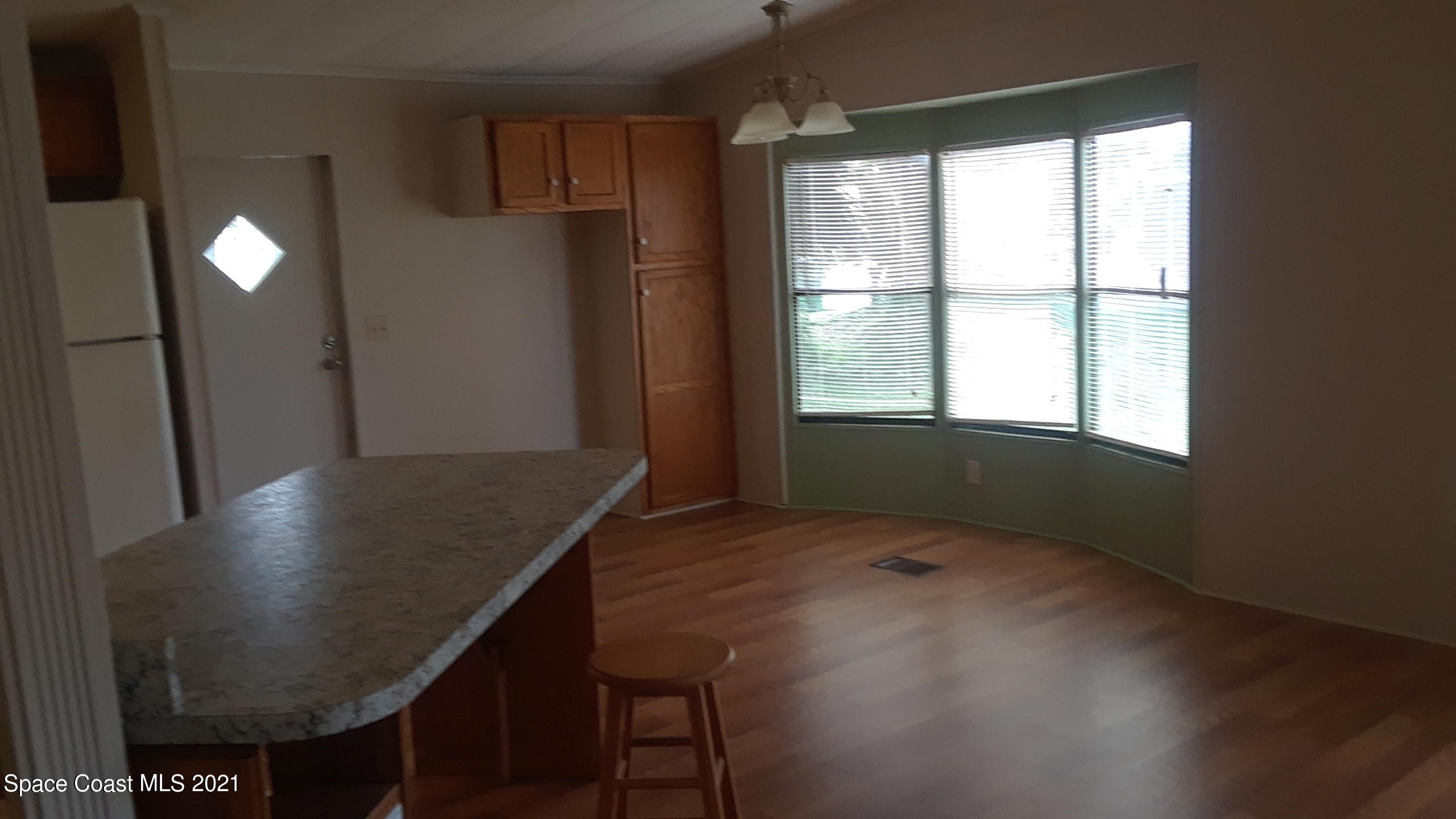 460 Baker Road Merritt Island, FL 32953 - Photo 3 of 6 a kitchen with kitchen island a window
