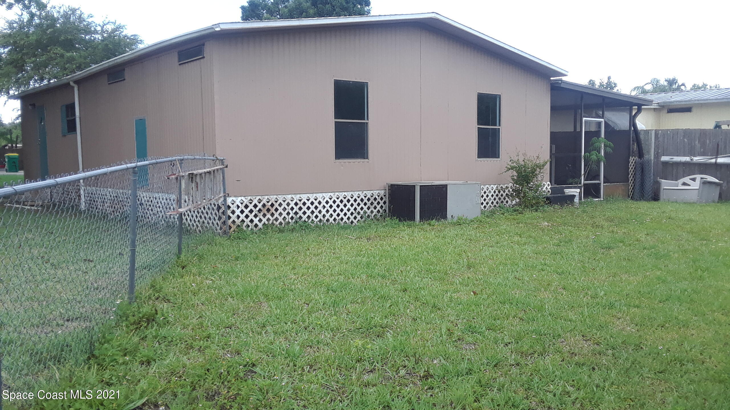 460 Baker Road Merritt Island, FL 32953 - Photo 5 of 6 a front view of a house with garden