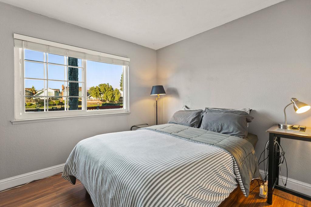 35664 Lundy Drive Newark, CA 94560 - Photo 15 of 34 a bedroom with bed and wooden floor
