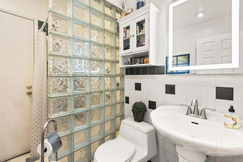 35664 Lundy Drive Newark, CA 94560 - Photo 16 of 34 a bathroom with a sink and a toilet