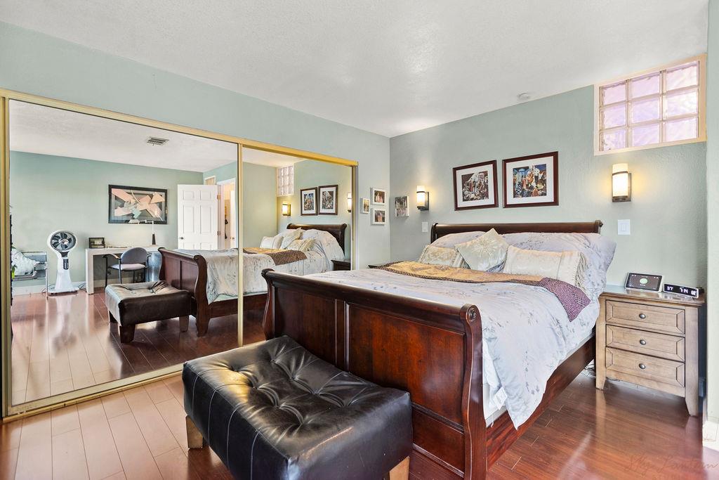 35664 Lundy Drive Newark, CA 94560 - Photo 22 of 34 a bedroom with a bed and wooden floor