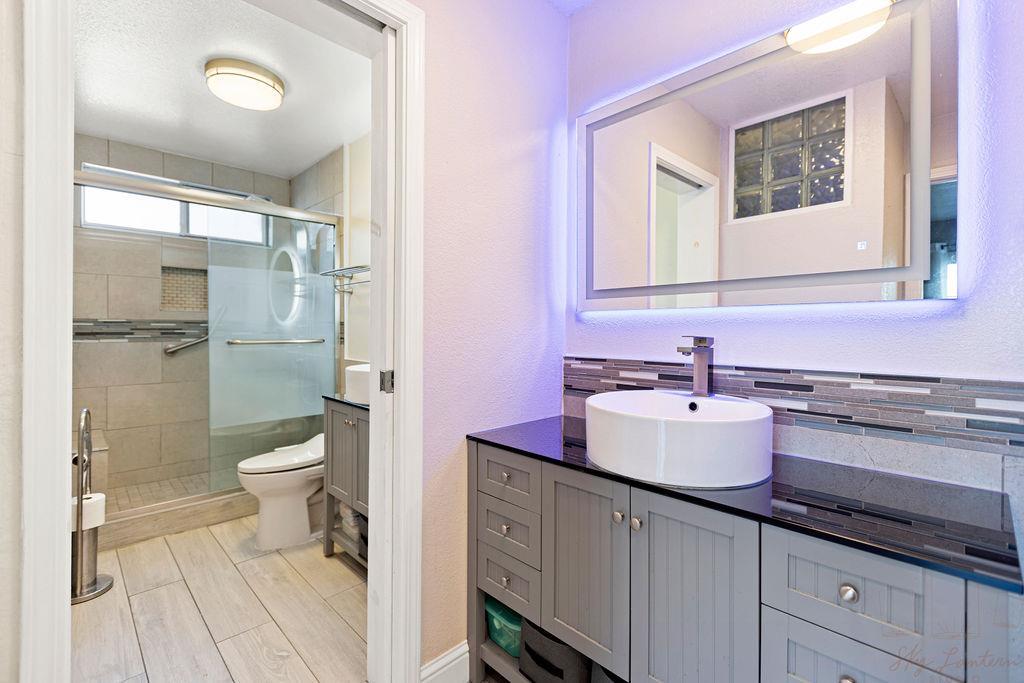 35664 Lundy Drive Newark, CA 94560 - Photo 23 of 34 a bathroom with a double vanity sink toilet and shower