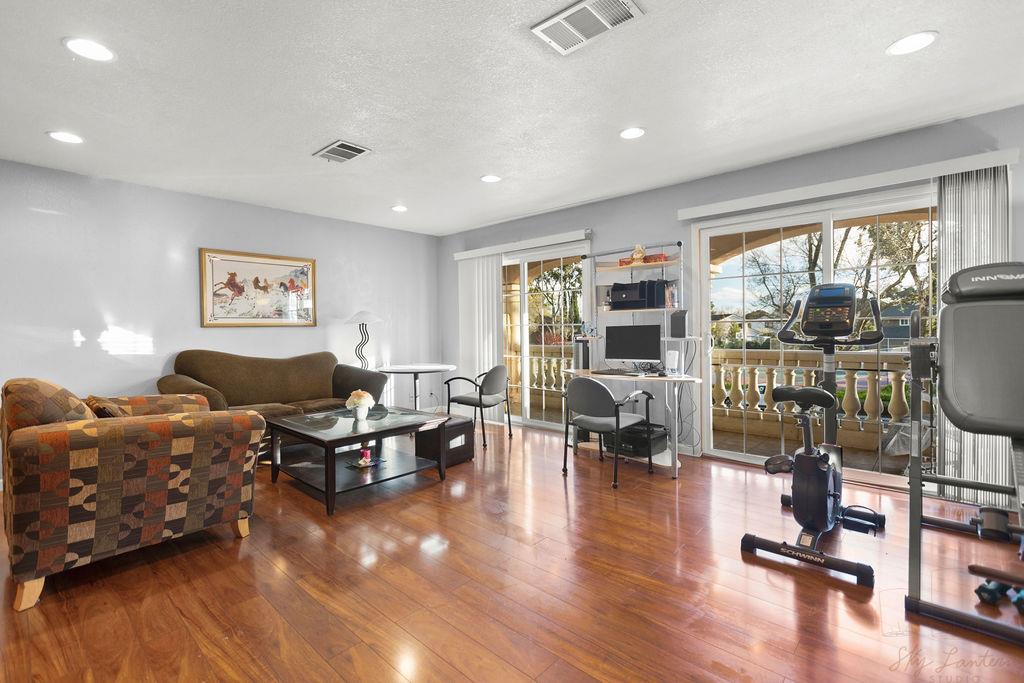 35664 Lundy Drive Newark, CA 94560 - Photo 24 of 34 a living room with furniture large window and wooden floor