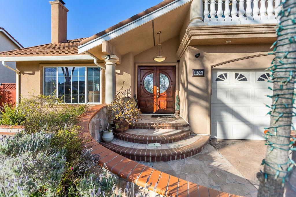 35664 Lundy Drive Newark, CA 94560 - Photo 6 of 34 a front view of a house with entertaining space