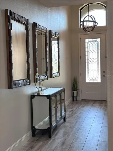 a view of kitchen with cabinets and wooden floor
