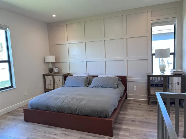 a bedroom with bed and window