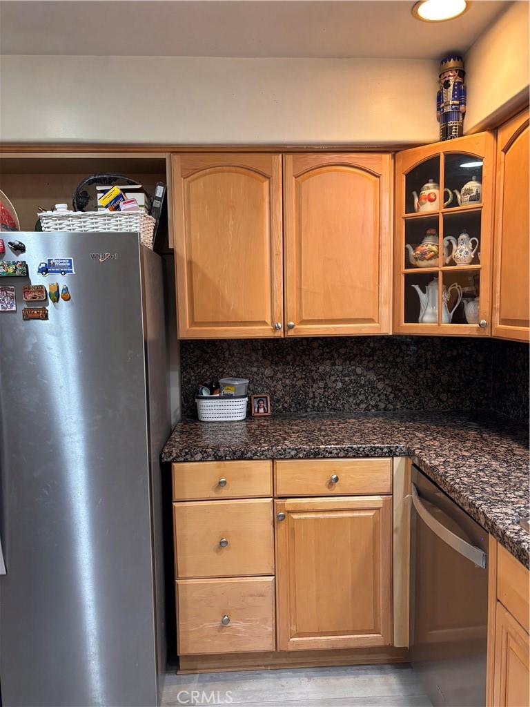 5604 Tower Road Riverside, CA 92506 - Photo 35 of 70 a kitchen with stainless steel appliances granite countertop a refrigerator and a stove