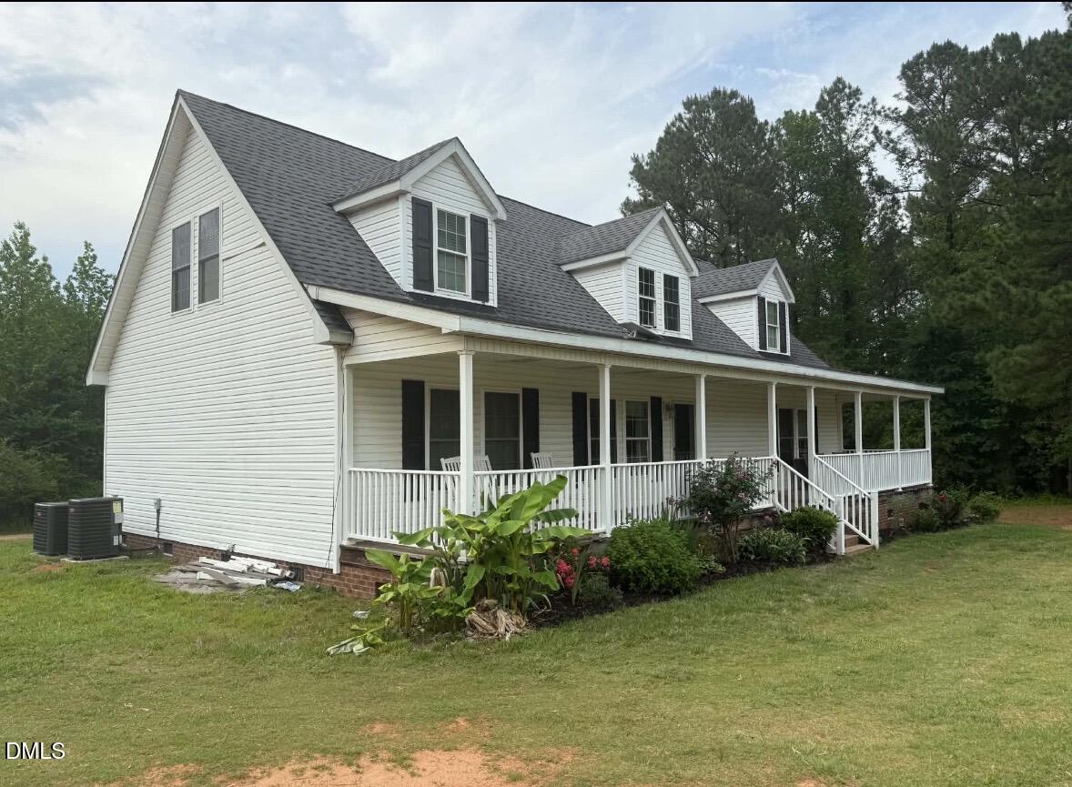 344 J B Leonard Road Castalia, NC 27816 - Photo 19 of 32 a front view of a house with a yard and potted plants
