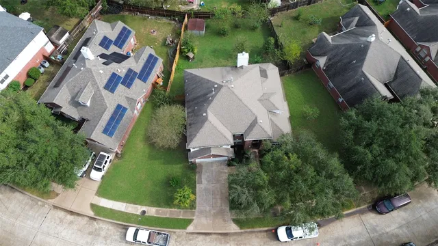 an aerial view of a house with outdoor space