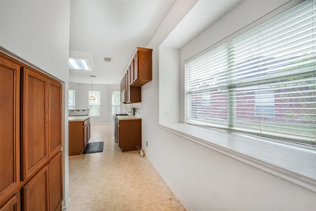 a view of kitchen with furniture and large window