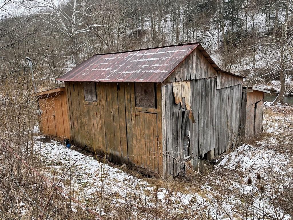 402 Deep Valley Road Aleppo, PA 15310 - Photo 2 of 7 a view of barn with wooden fence
