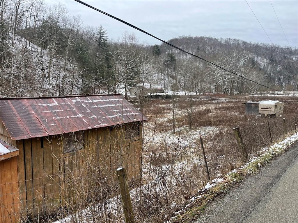 402 Deep Valley Road Aleppo, PA 15310 - Photo 7 of 7 a view of a yard with large tree