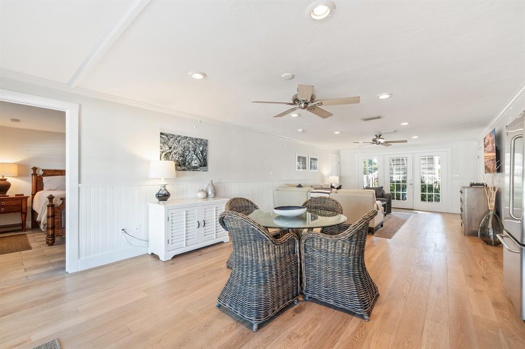 161 1st Street East Boca Grande, FL 33921 - Photo 16 of 38 a view of a dining room with furniture and wooden floor