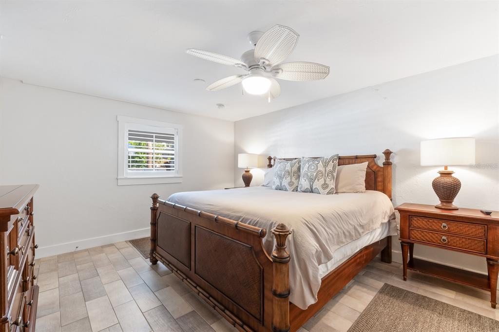 161 1st Street East Boca Grande, FL 33921 - Photo 17 of 38 a bedroom with a bed and window
