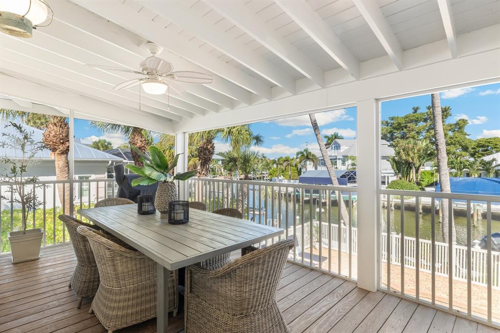 161 1st Street East Boca Grande, FL 33921 - Photo 20 of 38 a view of a dining room with furniture window and wooden floor