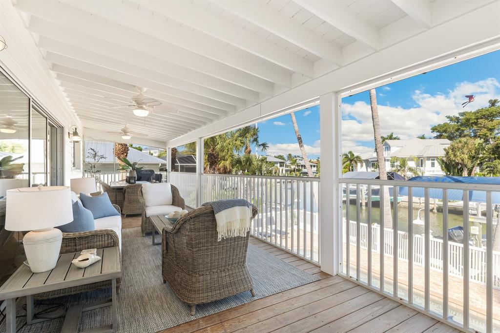 161 1st Street East Boca Grande, FL 33921 - Photo 23 of 38 a living room with furniture and a large window