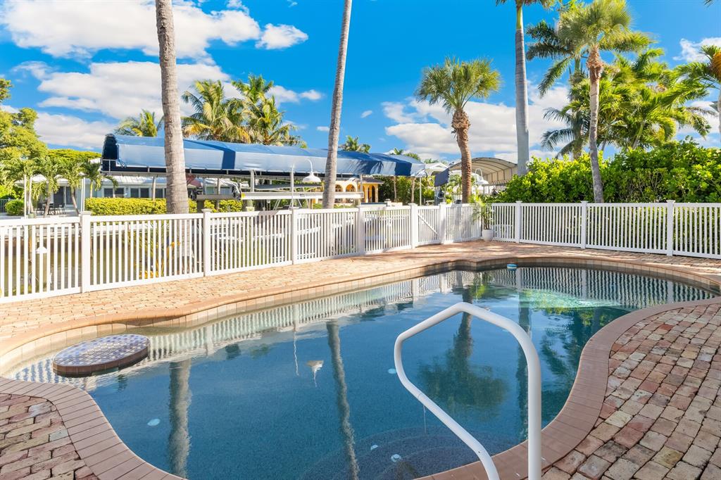 161 1st Street East Boca Grande, FL 33921 - Photo 27 of 38 a view of swimming pool with outdoor seating