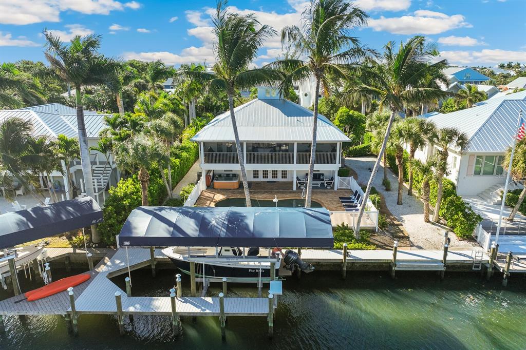 161 1st Street East Boca Grande, FL 33921 - Photo 29 of 38 a small pool with couple of relaxing chair