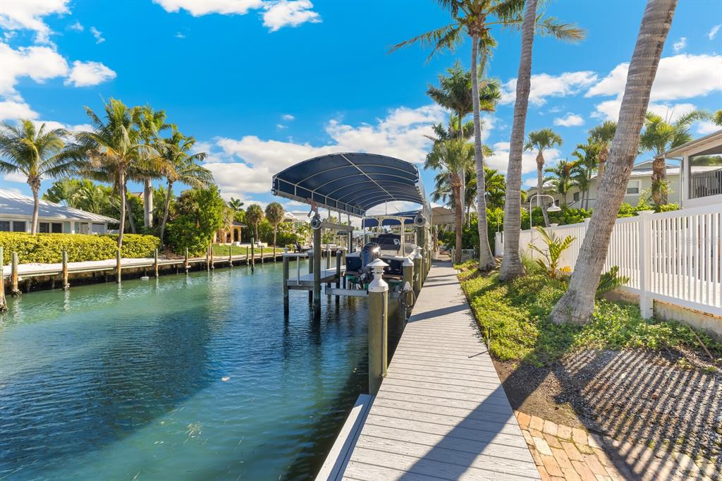 161 1st Street East Boca Grande, FL 33921 - Photo 31 of 38 a view of a lake with a patio