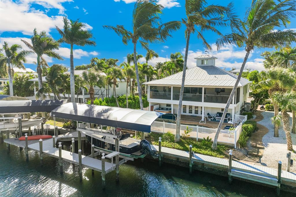 161 1st Street East Boca Grande, FL 33921 - Photo 33 of 38 a view of swimming pool with outdoor seating