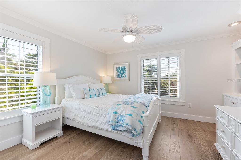 161 1st Street East Boca Grande, FL 33921 - Photo 10 of 38 a bedroom with a bed and a window