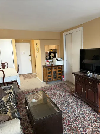 a living room with a couch and a flat screen tv