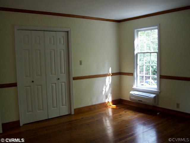 14120 Nash Road Chesterfield, VA 23838 - Photo 11 of 21 a view of empty room with wooden floor and fan