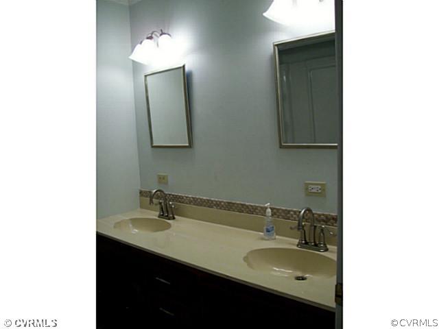 14120 Nash Road Chesterfield, VA 23838 - Photo 14 of 21 a bathroom with a sink and a mirror