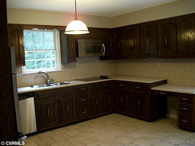 14120 Nash Road Chesterfield, VA 23838 - Photo 5 of 21 a kitchen with a cabinets and window