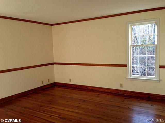 14120 Nash Road Chesterfield, VA 23838 - Photo 10 of 21 an empty room with wooden floor and windows