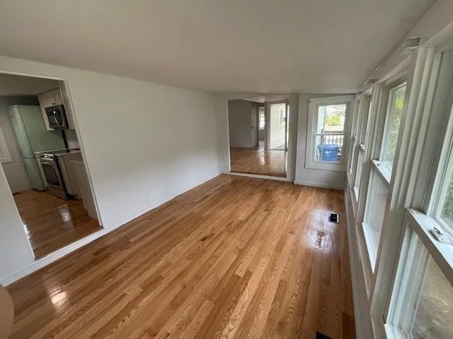 a view of an empty room with a window