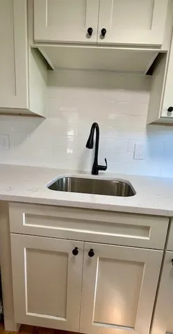 a bathroom with a toilet and a sink