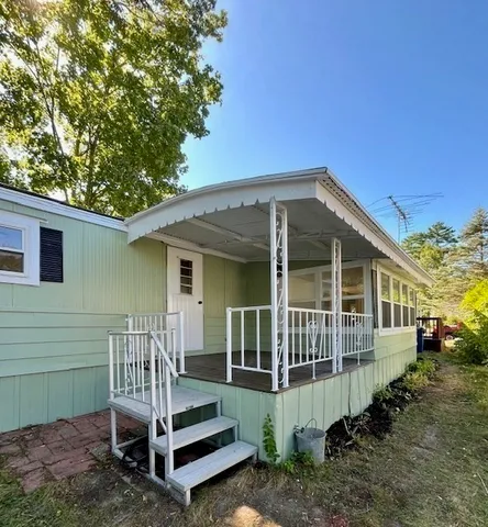 a house view with a backyard space