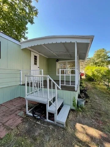a view of outdoor space with wooden floor