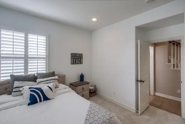 a view of a patio with couches table and chairs and potted plants